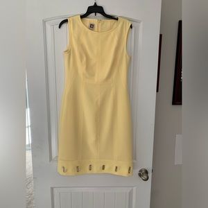 Yellow dress with silver accents on bottom.
